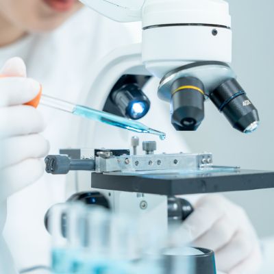 Scientist analyze biochemical samples in advanced scientific laboratory. Medical professional use microscope look microbiological developmental of viral. Biotechnology research in science lab.